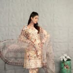 Graceful Beige Floral Attire with Flowing Dupatta